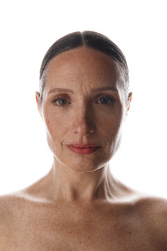 Portrait of a woman with her hair tied back and natural makeup