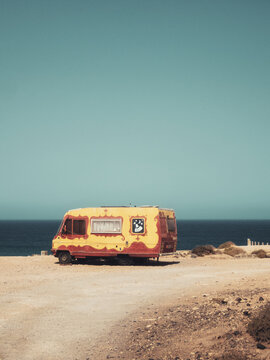 Colorful Camper Van on Coastal Landscape at El Cotillo