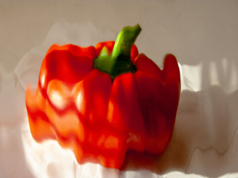abstract red bell pepper with a vibrant green stem 