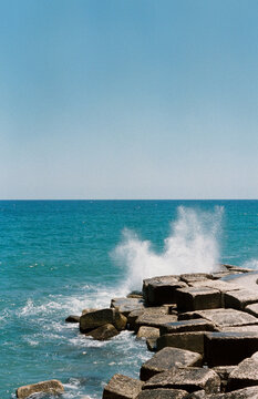 The sea splashing on the stones
