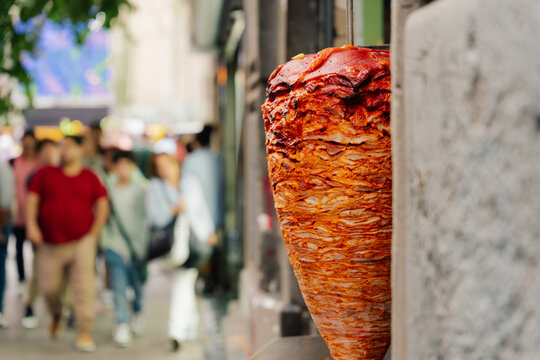 Al pastor taco meat on spit