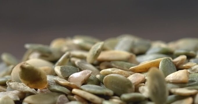 Pumpkin seeds falling in super slow motion
