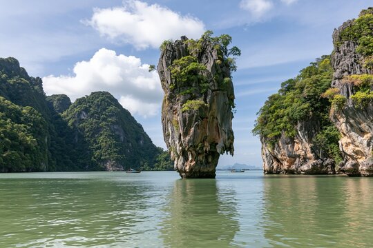 The Majestic Sea Stack in Tropical Emerald Waters Surrounded by Cliffs