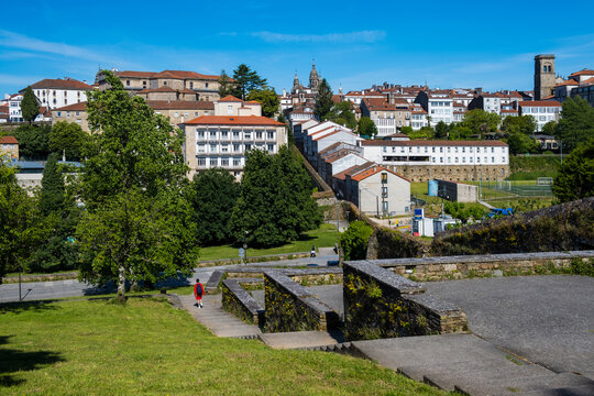 Panoramic scenic view of the historic old town skyline, cathedral towers, and terracotta roofs from the terraces of Parque de Belvis