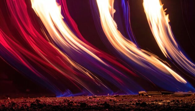 Abstract vibrant fire light trails moving across dark ground