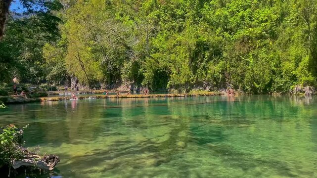 People playing in water at Semuc Champey Guatemala 