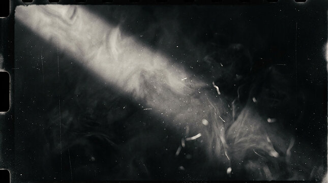 Vintage film frame overlay with light leak and dust texture for retro photography effects.