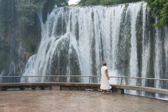 Pliva Waterfall in Jajce, Bosnia and Herzegovina surrounded by lush green forest