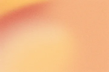 Abstract background showing blurred red, orange and yellow color gradient with grain texture © colnihko