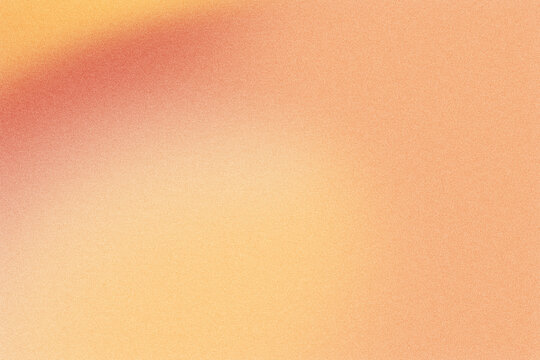 Abstract background showing blurred red, orange and yellow color gradient with grain texture