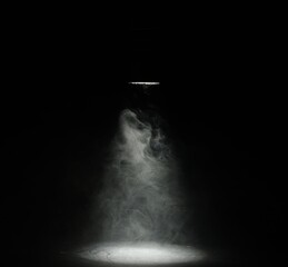 Naklejka premium Beautiful smoke in light and lamp on dark background