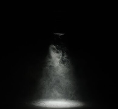 Beautiful smoke in light and lamp on dark background