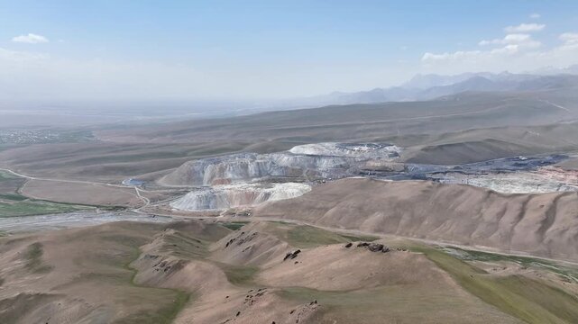 Aerial drone orbit of Sary Mogol coal mine spoil dumps in Kyrgyzstan