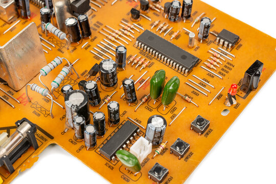 Brown printed circuit board components and parts. A circuit board with radio components from an electronic device.