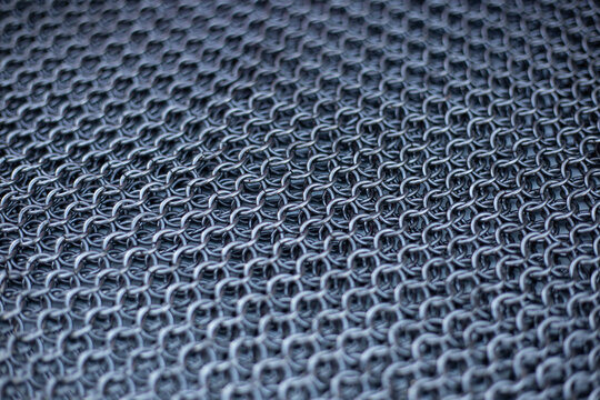 Chain mail. Detailed close-up texture of interlocking metal chainmail rings.