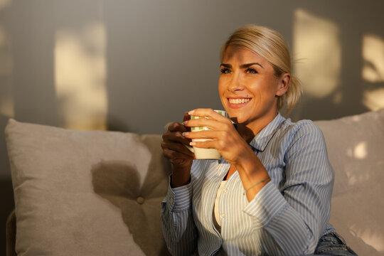 Woman Enjoying a Warm Drink at Home During Her Time of Rest and Relaxation in a Digital Detox Setting