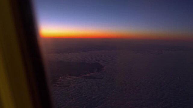 Breathtaking Aerial View of a Sunset Through an Airplane Window in 4k