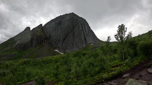 Static wide view of hiking trail leading toward Segla mountain peak in Senja Norway