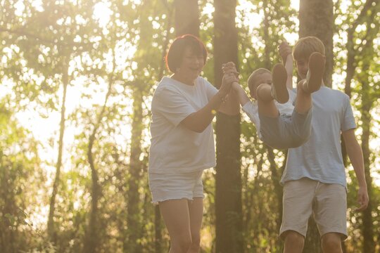  young family spending time together outdoors.