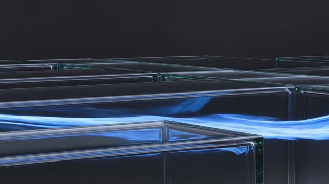 Luminous blue vapor flowing through a glass maze labyrinth
