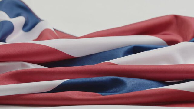 Waving United Kingdom flag on white background