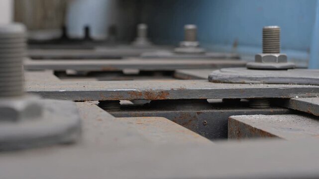 Close-up of shaking industrial machine plates