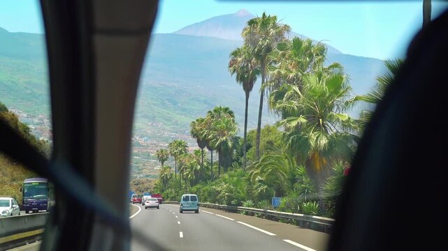 An exhilarating car journey across Tenerife Island with stunning views of the majestic Mount Teide in 4k slow motion 60fps