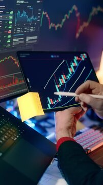 Crypto Bull Market Technical Analysis Drawing Resistance Lines Tablet Display. Over the shoulder view of trader analyzing cryptocurrency market growth drawing green candles and resistance trendlines