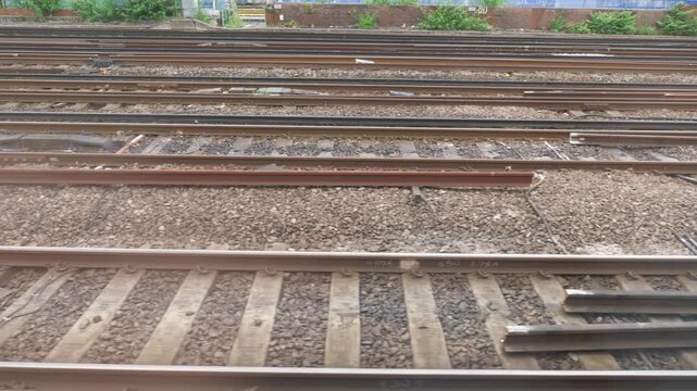 A view from a moving train of railway tracks in 4k slow motion 60fps