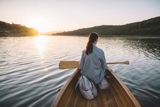 Quiet sunset moment in canoe on tranquil water