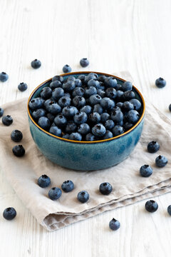 Healthy Organic Raw Blueberries in a Bowl, side view.