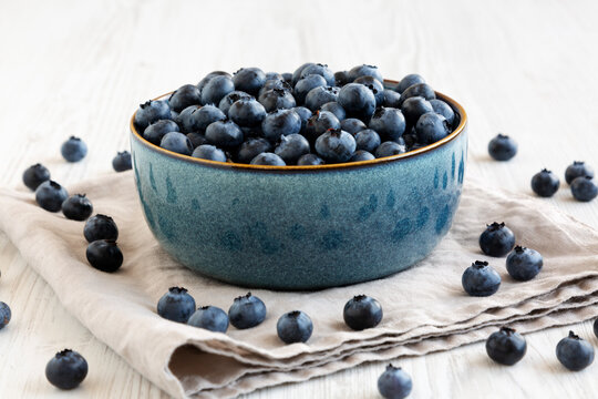 Healthy Organic Raw Blueberries in a Bowl, side view.