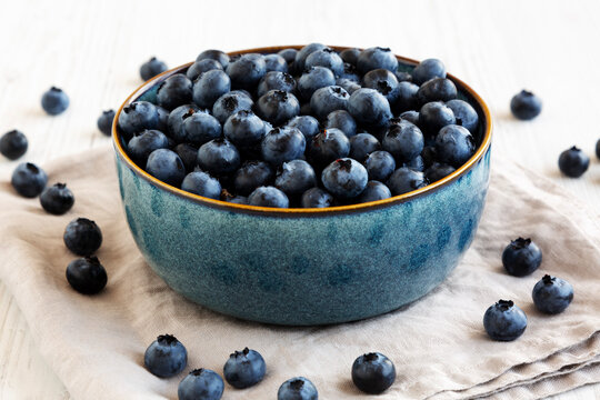 Healthy Organic Raw Blueberries in a Bowl, side view.
