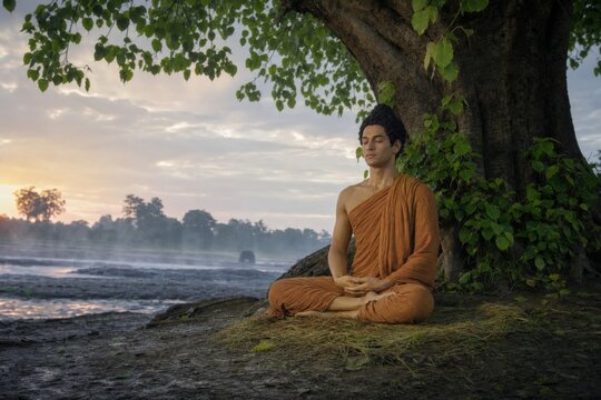 Man meditating beneath a tree beside a misty river at sunset. Buddhist mindfulness, spiritual practice, inner peace, and nature connection concept.