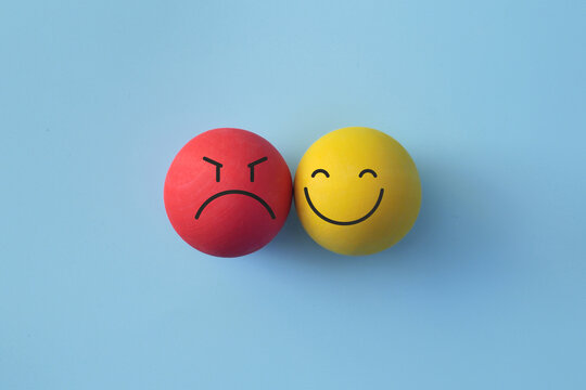 Sad and happy faces together