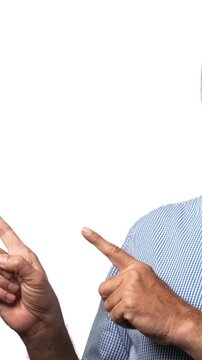 Indian Asian senior businessman with a white beard pointing both hands with a playful smile, enjoying  a moment of lighthearted mischief and fun 