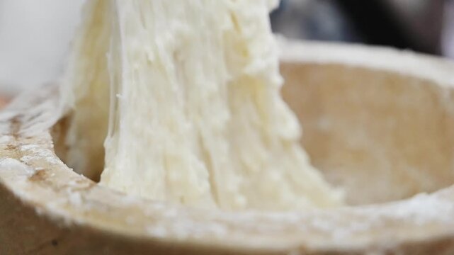 Traditional Mochi Being Pounded in a Wooden Mortar