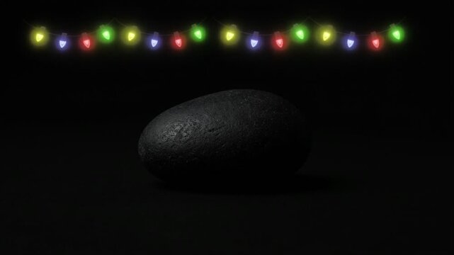 dark pebble with festive christmas lights background