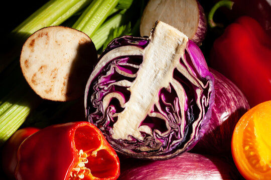 sliced red cabbage vegetable mix on black background
