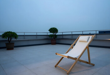 Fototapeta premium Empty wooden deck chair with white fabric and pillow on a rooftop terrace with Potted plants and a railing, Potted green plants are arranged along a low wall with a metal railing