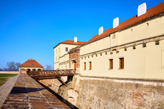 Historic european castle with stone walls and wooden bridge