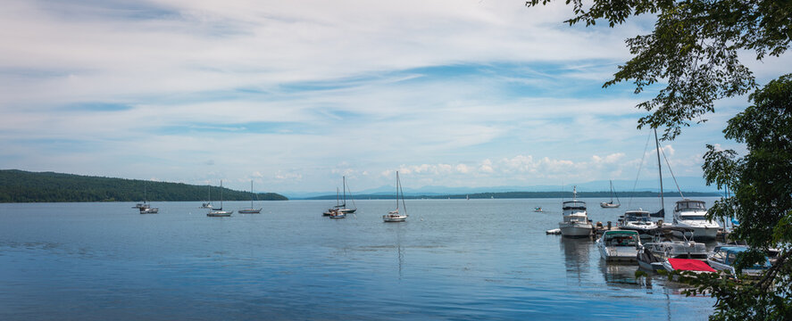 Lake Champlain summer landscape with moored boats and yachts in New York