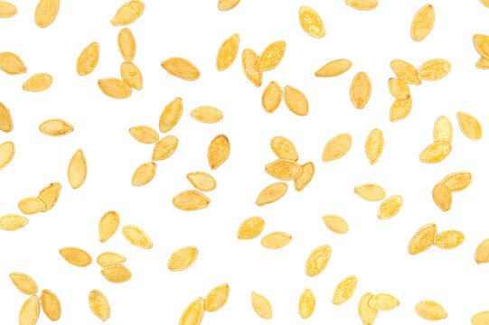 Roasted pumpkin seeds with salt isolated on white background, pattern and scattered, top view