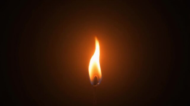 Single Bright Orange Flame of a Candle Burning in Darkness with Soft Glow ablaze amber