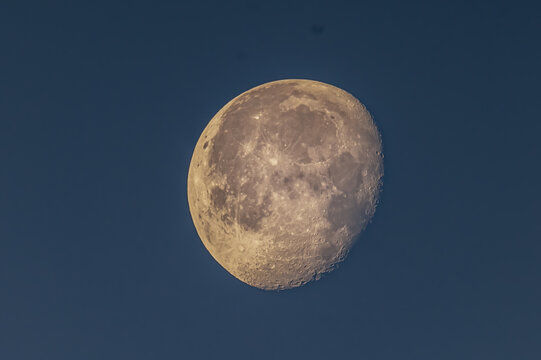 View of the moon against a dark blue night sky in Jahanian, Pakistan.