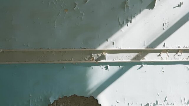 Solitary woman with backpack stands in decrepit interior space beside window overlooking green landscape, surrounded by crumbling whitewashed walls, evoking exploration, decay, solitude.