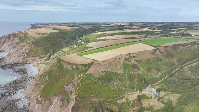Cliffs and Fields over Welcombe Mouth Beach from a drone, North Devon and Cornwall Coastpath Border, Devon, England, Summer 2026