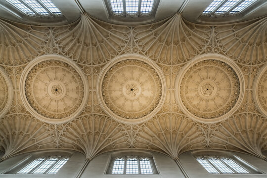 View of the intricate fan-vaulted ceiling of King's College Chapel with detailed stone carvings and gothic architecture in Cambridge, England, United Kingdom.