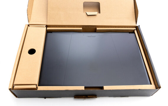 New laptop computer neatly packed inside its cardboard box