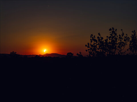 Partial solar eclipse in 2026 at the city of Zagreb, Croatia when moon covered part of the sun at sunset